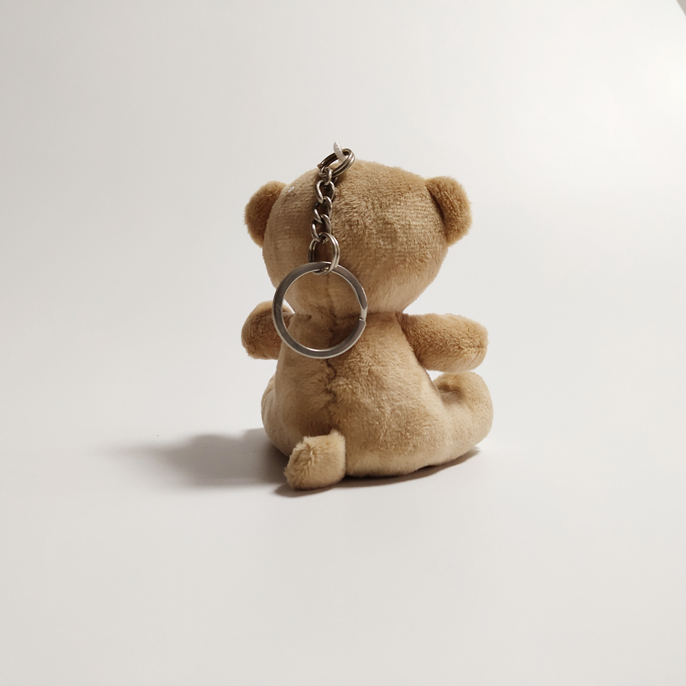 Yd-x008 beer sleutelhanger opgestopte sitende dier met 'n sagte sagte speelding van die t-hemp